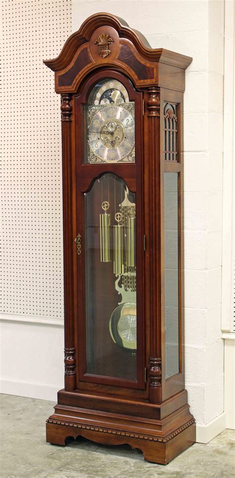 The line of grandfather clocks was . . Sligh grandfather clock